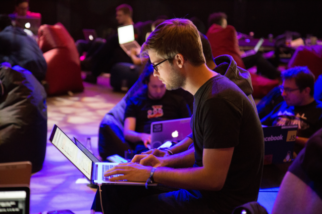 Person in crowd with laptop