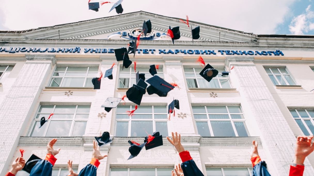 University graduates throwing their caps in the air
